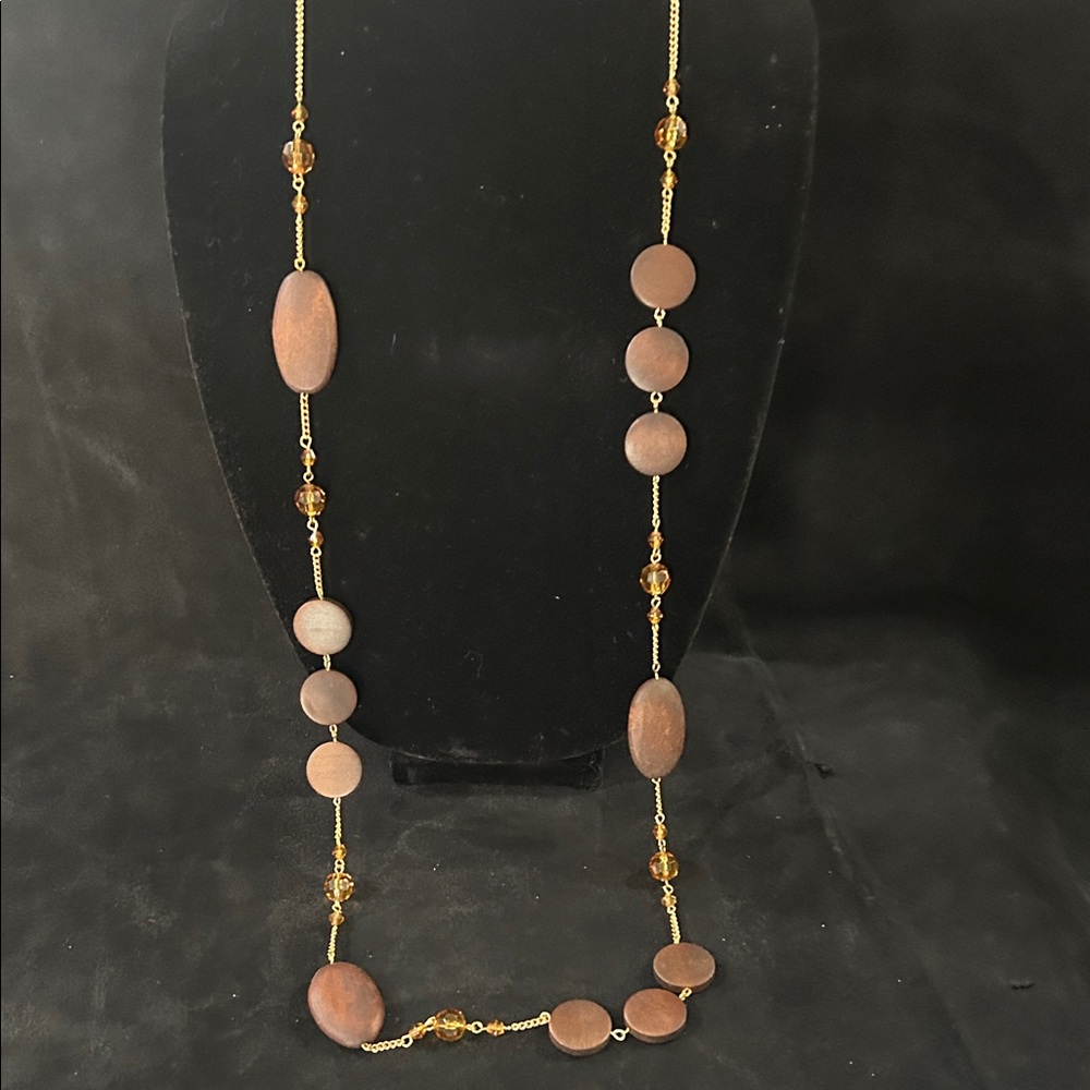 Elegant Gold and Brown Beaded Necklace with matching earrings.